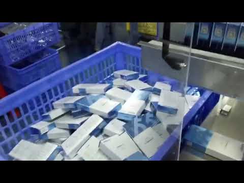 “Automated 3D packing machine with added cartoning feature for shampoo cartridges.” “Automated 3D packing machine with added cartoning feature for shampoo cartridges.”