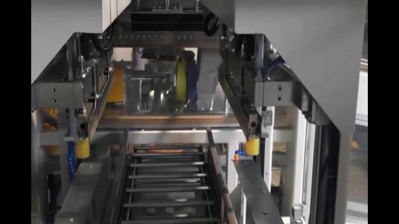 Automated sleeve packaging machine for wire coils with four-side sealing, optimized for efficiency.