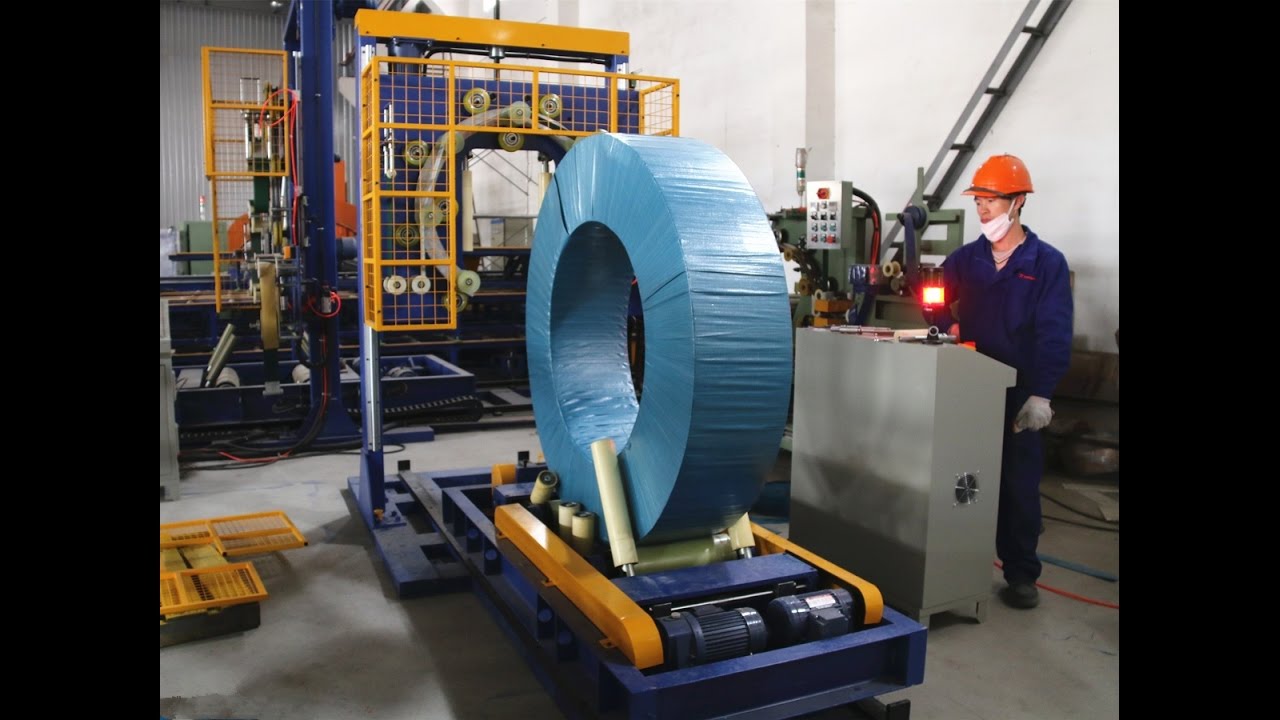 Automated steel coil packing machine with trolley enhanced for Posco. Optimized and streamlined for efficient operation.