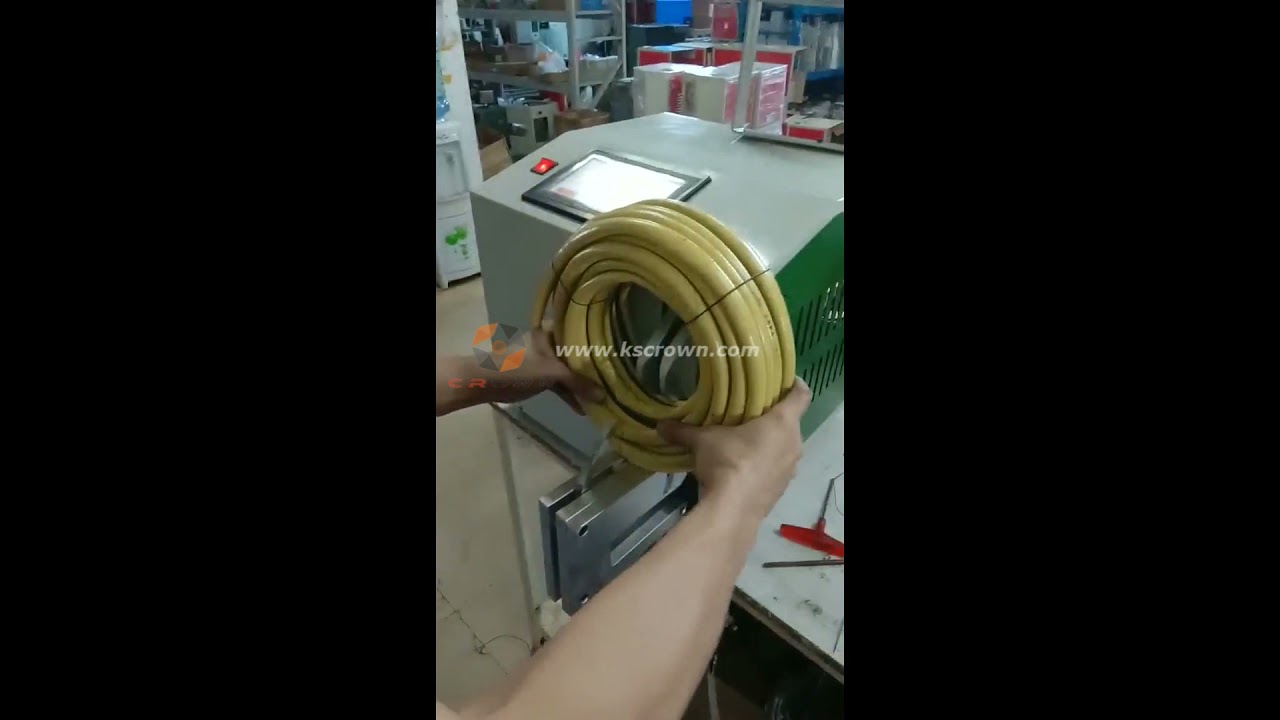 Coil Bundling and Tying Machine for Tubes, Wires, and Hoses.