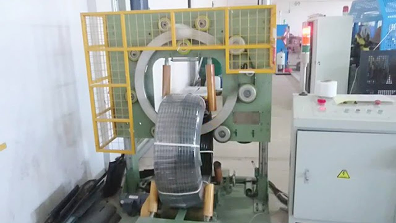 Coil film wrapping machine for wire cables and rolls.