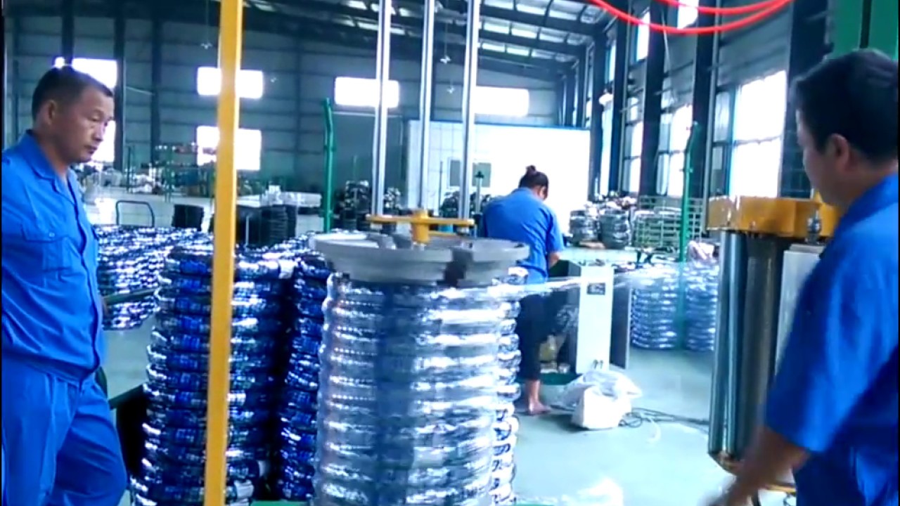 Coil packing machine for hose and cable that is semi-automatic and optimized.