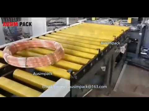 Coil wrapping and packing machine for cables, pipes, and iron coils. Coil wrapping and packing machine for cables, pipes, and iron coils.