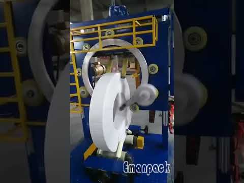 Coil wrapping machine with automated film cutting.