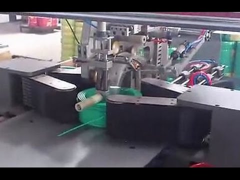 Coiling and packing machine for hoses and cables, with automated functionality.