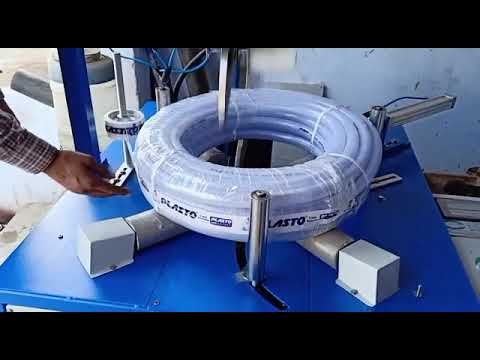 Coiling machine for braided hose pipe wrapping with optimized design.