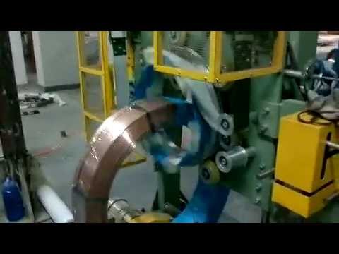 Copper coil packaging machine for tubes and wires.