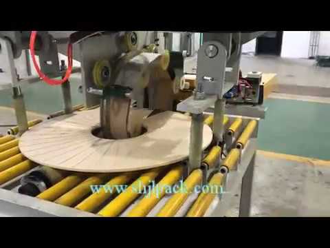 Efficient Copper Coil Packing Machine with Automatic Slitting and Stretch Wrapping Capabilities.