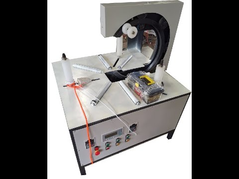 Efficient Packing Machine for Tires and Ring Coils.