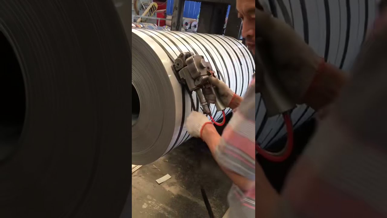 “Efficiently strap steel coils with PET strap using pneumatic tool”