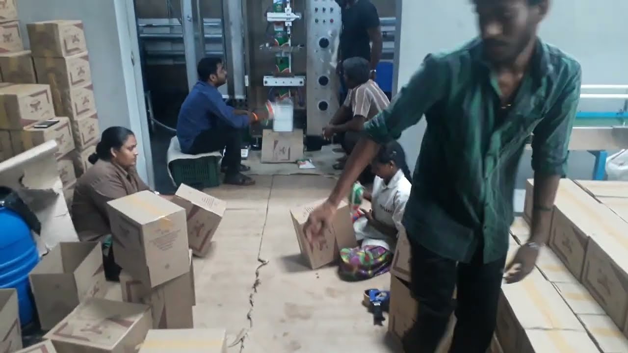 High-speed oil pouch packing machine with PLC and HMI control. Suitable for one-liter pouches. Contact for more information.