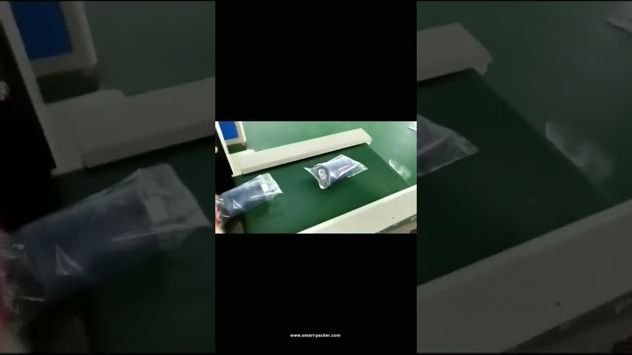 Horizontal bagging machine feeds and packs coil rolls efficiently.