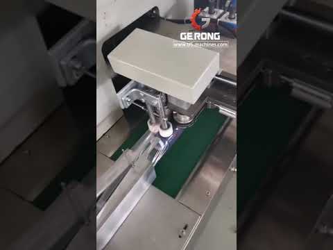 Horizontal flow wrapper for automatic packaging of string coils using film and flow bags.