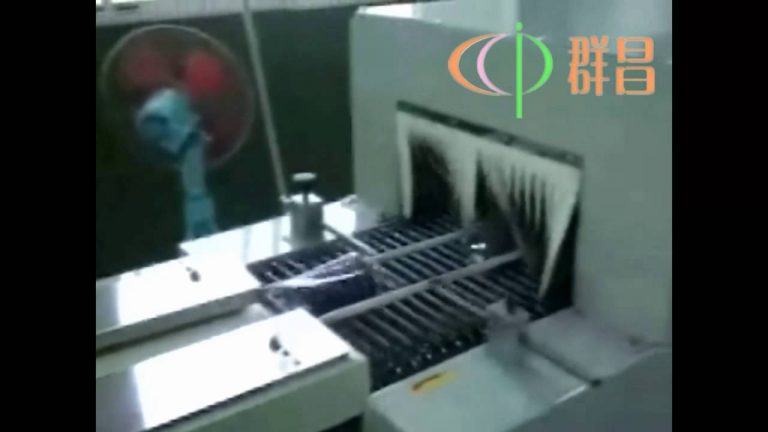 Horizontal sewing thread shrink wrap machine for plastic film packaging.
