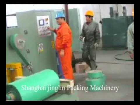 Improved coil packing machine uses paper, HDPE, and stretch film for efficient packaging in under 35 words. Improved coil packing machine uses paper, HDPE, and stretch film for efficient packaging in under 35 words.
