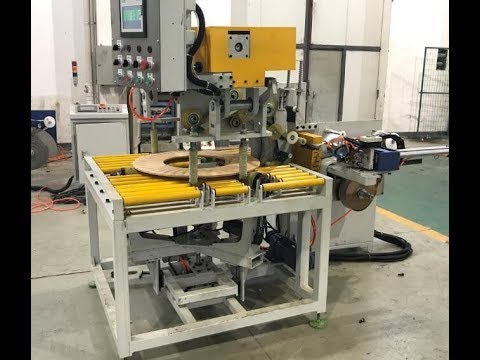 Improved packing machine for copper and alloy steel strips with enhanced efficiency and reduced size.