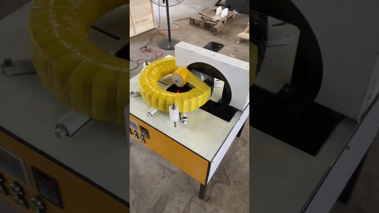 Machine for wrapping tires and coils with horizontal stretch film.