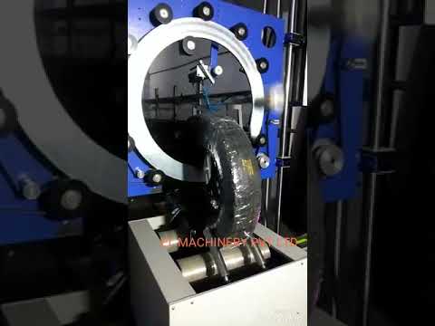 Motorized steel coil wrapping machine with ring up-down system and trolley optimized for efficiency.