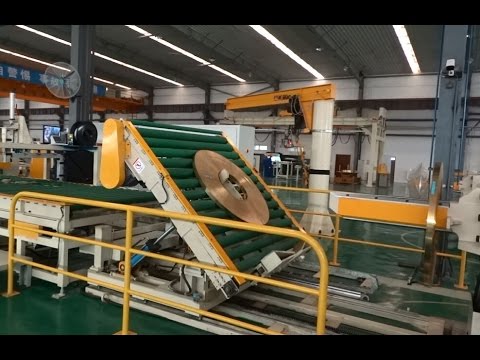 Optimized coil packing and strip slitting system for steel packaging, under 35 words.