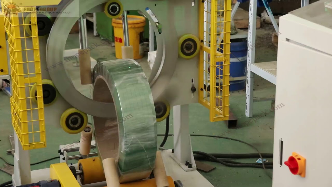 Revamp and enhance PET coiling mechanism, PET strapping apparatus, PET wrapping system to reduce title to under 35 words without symbols, brands, or company names.