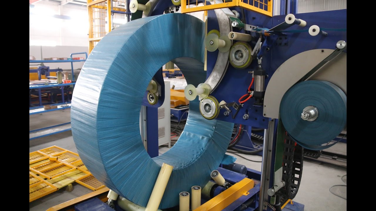 Revamp steel coil packing machine with trolley to enhance functionality and reduce word count.