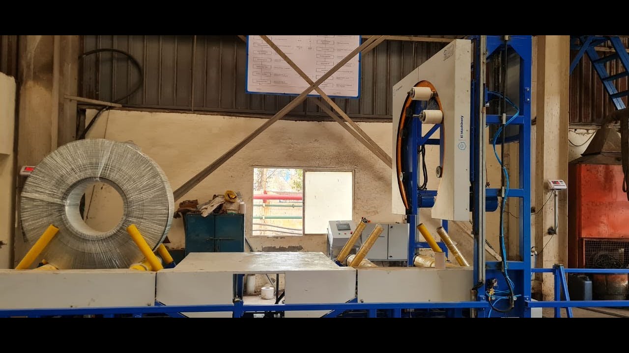 “Revolutionary Steel Coil Wrapping System with Motorized Ring Plate and Dual Trolley Car Design”