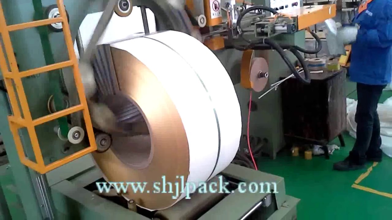 Steel coil wrapping equipment for efficient packaging.