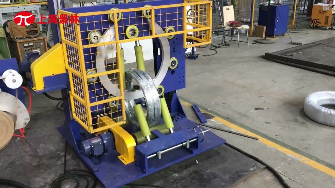 Vertical steel wire wrapping machine for automatic packing of steel coils.