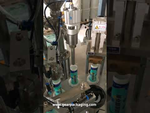 Wall repair paste tube filling and sealing machine with rotary hose for efficient packaging.