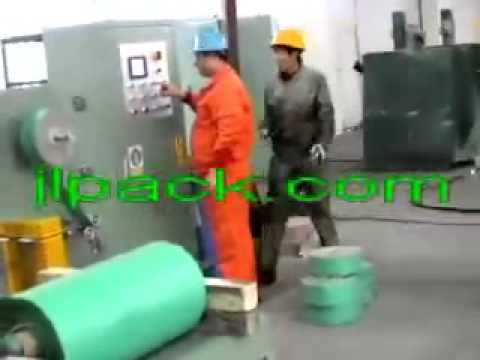 Wire coil packaging machine for stretch wrapping and packing.