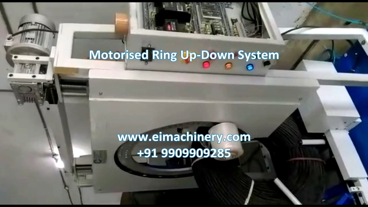 Wrapping machine for steel coils in a vertical orientation.