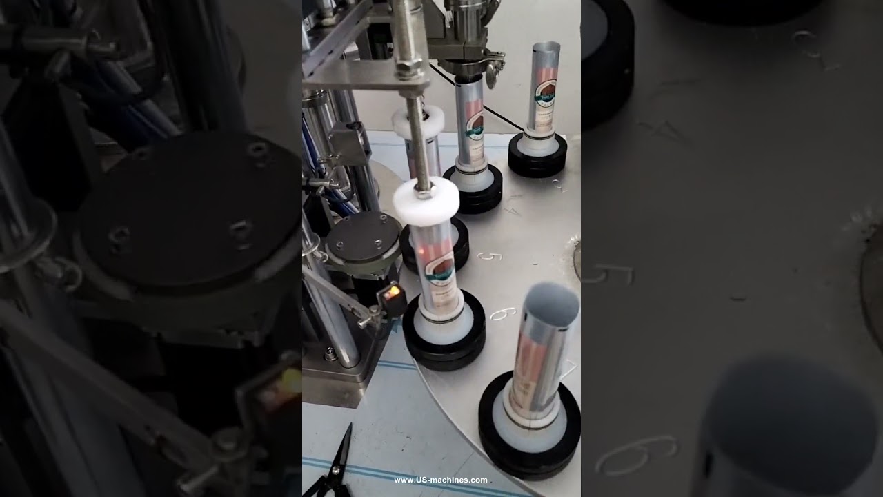 Automatic rotary cream filling and sealing machine for soft tube packaging, designed for efficient production.