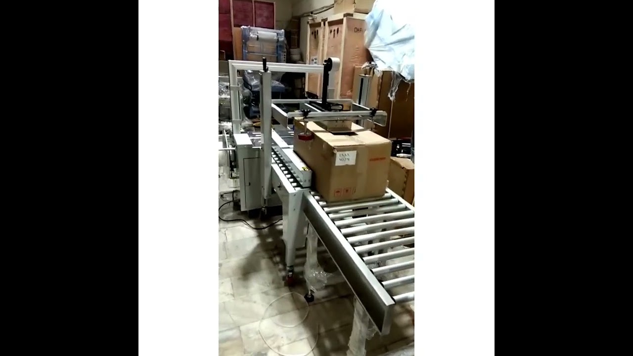 Revolutionary Taping and Strapping Machine: Boost Efficiency & Productivity!