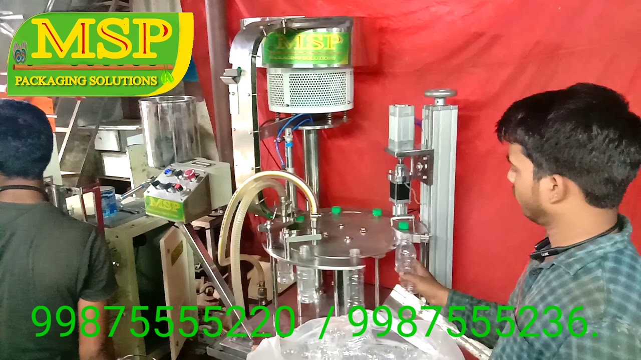 Bottle Filling and Packing Machine Bottle Filling and Packing Machine