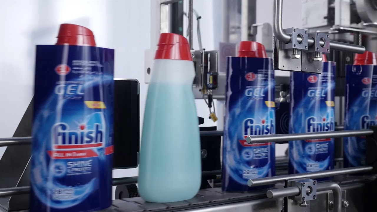 Efficient Sleeve Applicator and Shrink Tunnel for Body Shaped Bottles: 12,000 bph Capacity