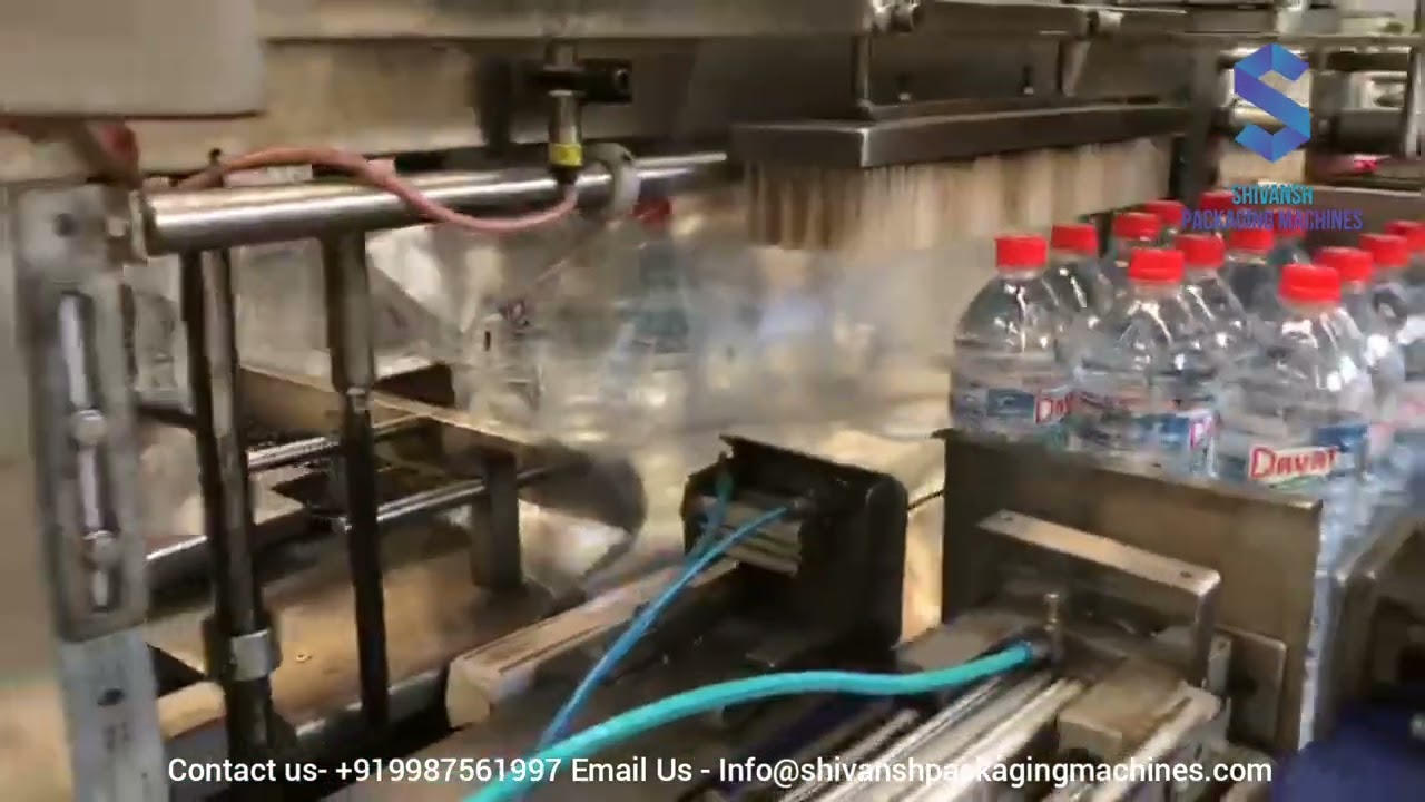 Fully Automated Shrink Wrapping Machine: 120 BPM for 1 Ltr Water Bottles Fully Automated Shrink Wrapping Machine: 120 BPM for 1 Ltr Water Bottles