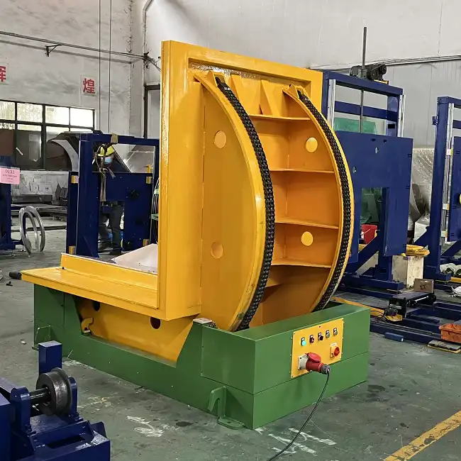 Steel coil packing line — The down-ender (shown) is the first battery-limit interface on most lines: coil transfer between horizontal and vertical defines the station hand-off.